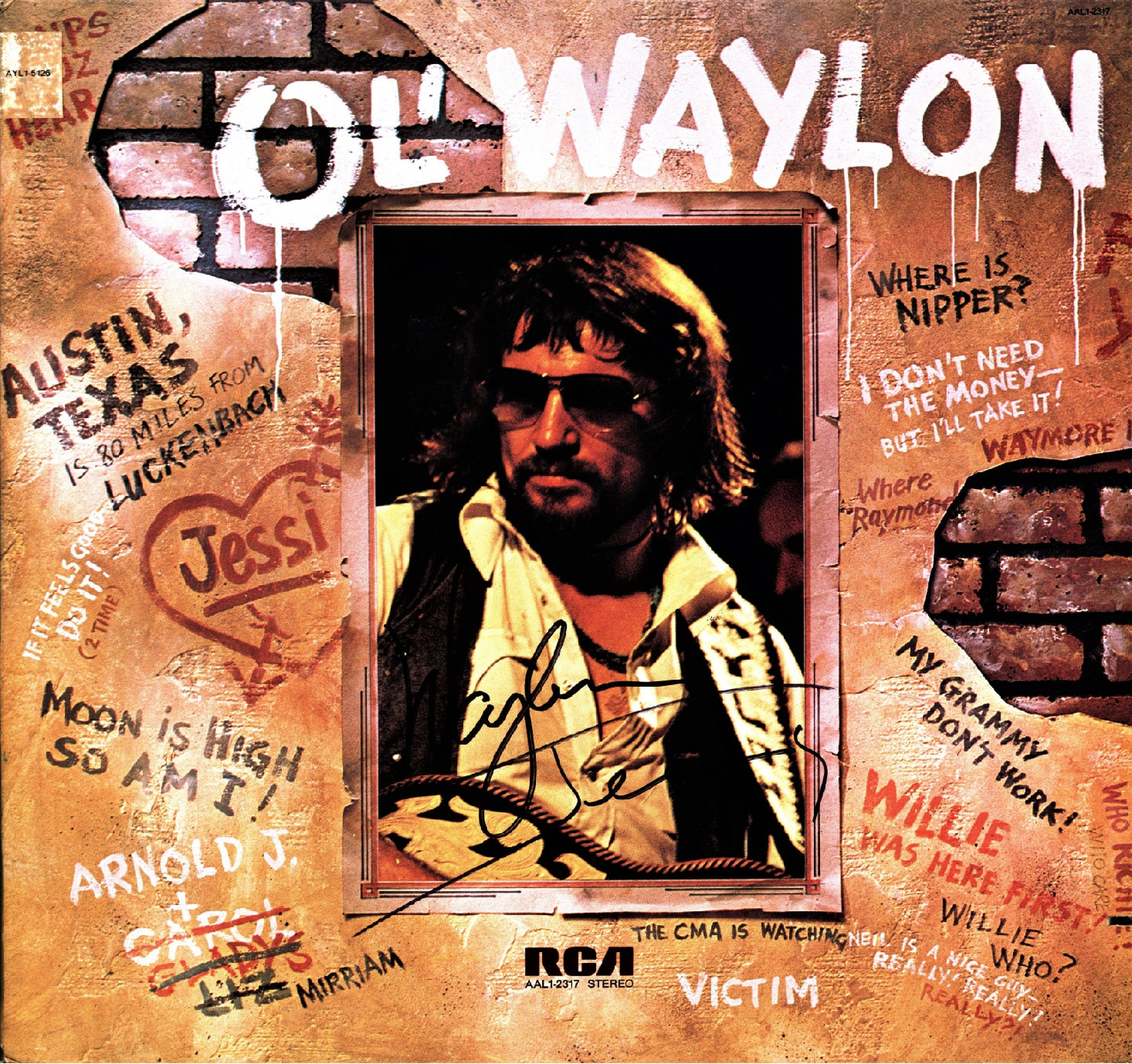 Waylon Jennings Autographed Lp "Ol' Waylon" - Zion Graphic Collectibles